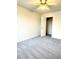 Carpeted bedroom with an overhead fan, closet and ample natural light at 9844 Ashton Pines Ct, Las Vegas, NV 89147