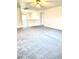 Large carpeted bonus room with abundant natural light at 9844 Ashton Pines Ct, Las Vegas, NV 89147