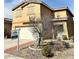 Two-story home featuring a two-car garage and neutral stucco exterior with a For Sale sign at 9844 Ashton Pines Ct, Las Vegas, NV 89147
