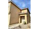 Side view of a two-story home featuring a neutral stucco exterior at 9844 Ashton Pines Ct, Las Vegas, NV 89147