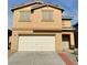 Two-story home featuring a two-car garage and neutral stucco exterior at 9844 Ashton Pines Ct, Las Vegas, NV 89147