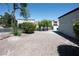 Gravel backyard with manicured landscaping and a neutral exterior, ideal for relaxing at 10532 Redwood Ash Ave, Las Vegas, NV 89144