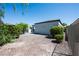 Gravel backyard with manicured landscaping and a neutral exterior, perfect for low-maintenance living at 10532 Redwood Ash Ave, Las Vegas, NV 89144