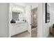 A modern bathroom with a single vanity and a walk-in shower at 10532 Redwood Ash Ave, Las Vegas, NV 89144