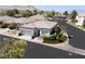 Exterior view of the home, with landscaping and views of the surrounding neighborhood at 10532 Redwood Ash Ave, Las Vegas, NV 89144