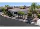 Exterior view of this single-story home, featuring desert landscaping and a side yard at 10532 Redwood Ash Ave, Las Vegas, NV 89144