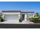 Beautiful single-story home with an attached two-car garage and modern exterior design at 10532 Redwood Ash Ave, Las Vegas, NV 89144