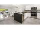 Open-concept kitchen with stainless steel appliances and sleek countertops at 10532 Redwood Ash Ave, Las Vegas, NV 89144
