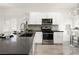 Well-equipped kitchen featuring stainless steel appliances and modern cabinetry at 10532 Redwood Ash Ave, Las Vegas, NV 89144