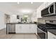 Open-concept kitchen with stainless steel appliances and modern cabinetry at 10532 Redwood Ash Ave, Las Vegas, NV 89144