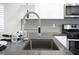 Modern kitchen sink with stylish faucet and sleek countertop at 10532 Redwood Ash Ave, Las Vegas, NV 89144