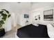 Bright main bedroom featuring an en-suite bathroom, large bed and sliding door access to the outdoors at 10532 Redwood Ash Ave, Las Vegas, NV 89144