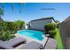 A relaxing pool features pristine blue water and a lounge area, creating a perfect backyard oasis at 10532 Redwood Ash Ave, Las Vegas, NV 89144