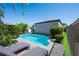Backyard pool with lounge chairs, perfect for entertaining and outdoor relaxation at 10532 Redwood Ash Ave, Las Vegas, NV 89144