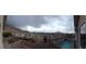 Wide-angle view of backyards and mountain scenery, adding to the allure of the neighborhood at 10642 Dawns Mist Ave, Las Vegas, NV 89129