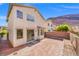 Spacious backyard featuring a well-maintained brick patio, ideal for outdoor entertaining and relaxation at 10642 Dawns Mist Ave, Las Vegas, NV 89129
