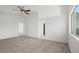 Bright bedroom with closet, ceiling fan, and windows providing natural light at 10642 Dawns Mist Ave, Las Vegas, NV 89129