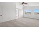 Spacious bedroom with large windows offering views of the surrounding area at 10642 Dawns Mist Ave, Las Vegas, NV 89129