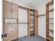 Walk-in closet with custom shelving and storage solutions at 10642 Dawns Mist Ave, Las Vegas, NV 89129