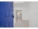 Bright entryway with tiled floors and a view of the carpeted staircase at 10642 Dawns Mist Ave, Las Vegas, NV 89129