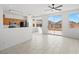 Bright dining area open to kitchen, tile floors, ceiling fan, and access to backyard at 10642 Dawns Mist Ave, Las Vegas, NV 89129
