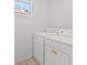 Bright laundry room featuring a washer and dryer at 10642 Dawns Mist Ave, Las Vegas, NV 89129