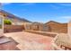 Outdoor patio with a brick wall and landscaping at 10642 Dawns Mist Ave, Las Vegas, NV 89129
