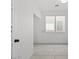 Bright room featuring neutral wall paint and tile flooring at 10642 Dawns Mist Ave, Las Vegas, NV 89129
