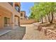 Spacious backyard features a covered patio and retaining wall, great for entertaining at 11816 Orense Dr, Las Vegas, NV 89138