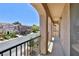 Arched balcony overlooking quiet residential street with wrought iron railing at 11816 Orense Dr, Las Vegas, NV 89138