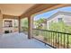Spacious covered balcony with wrought iron railing and neighborhood views at 11816 Orense Dr, Las Vegas, NV 89138