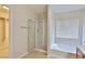 Bathroom featuring walk-in closet, shower and tub with natural light at 11816 Orense Dr, Las Vegas, NV 89138