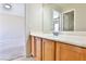 Bathroom features a vanity, sink, and a large mirror, with tile flooring at 11816 Orense Dr, Las Vegas, NV 89138