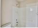 Bathroom features tiled walls, tub with shower, and built-in shelving at 11816 Orense Dr, Las Vegas, NV 89138