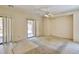 Generous bedroom with sliding glass door access to a patio and carpet flooring at 11816 Orense Dr, Las Vegas, NV 89138
