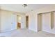 Neutral bedroom features closet space and adjoins bathroom and hallway at 11816 Orense Dr, Las Vegas, NV 89138