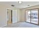 Bedroom featuring a sliding glass door out to the balcony with an adjoining bathroom at 11816 Orense Dr, Las Vegas, NV 89138