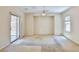 Bright bedroom with sliding glass door access to a patio, and a neutral color palette at 11816 Orense Dr, Las Vegas, NV 89138