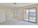 Bright bedroom features a sliding glass door leading to an outdoor balcony at 11816 Orense Dr, Las Vegas, NV 89138