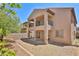 Exterior view of a multi-story home featuring balconies and a low-maintenance backyard at 11816 Orense Dr, Las Vegas, NV 89138