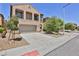 Attractive two-story home featuring a desert landscape and a two-car attached garage at 11816 Orense Dr, Las Vegas, NV 89138