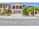 Charming two-story home featuring a desert landscape and a two-car attached garage at 11816 Orense Dr, Las Vegas, NV 89138