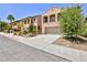 Inviting two-story home with a two-car garage, desert landscaping, and a private balcony at 11816 Orense Dr, Las Vegas, NV 89138