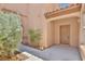 Covered front porch with decorative touches and desert landscaping at 11816 Orense Dr, Las Vegas, NV 89138