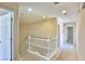 Hallway with access to bedrooms and bathrooms, showcasing a white railing at 11816 Orense Dr, Las Vegas, NV 89138
