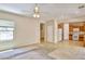 Open-concept living area with a ceiling fan and seamless flow to the kitchen at 11816 Orense Dr, Las Vegas, NV 89138