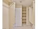 Walk-in closet featuring racks and a door at 11816 Orense Dr, Las Vegas, NV 89138