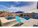 Backyard featuring a pool and hot tub with seating for outdoor enjoyment at 129 Barton Bay Ave, North Las Vegas, NV 89031