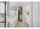 Bright bathroom featuring a soaking tub, shower, dual sink vanity, and access to a walk-in closet at 129 Barton Bay Ave, North Las Vegas, NV 89031