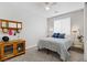 Cozy bedroom with bright natural light, side tables, and a modern wooden dresser at 129 Barton Bay Ave, North Las Vegas, NV 89031